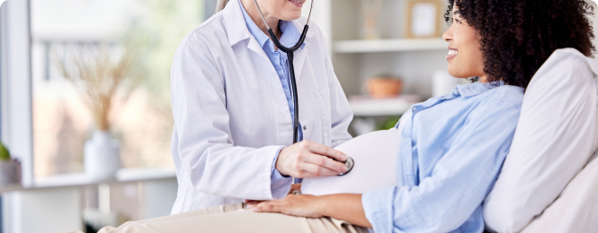 reason-to-join-img (1) Doctor using a stethoscope to listen to a patient's chest during a checkup in a bright clinic.